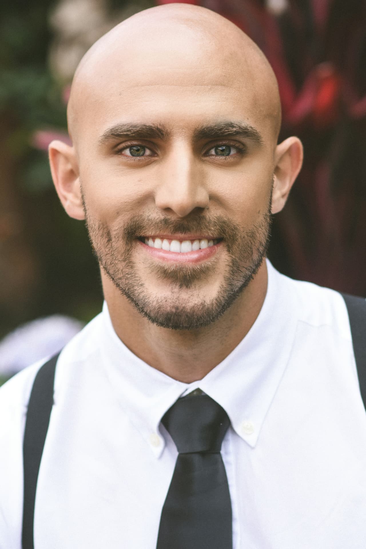 Bald man with neatly groomed facial hair